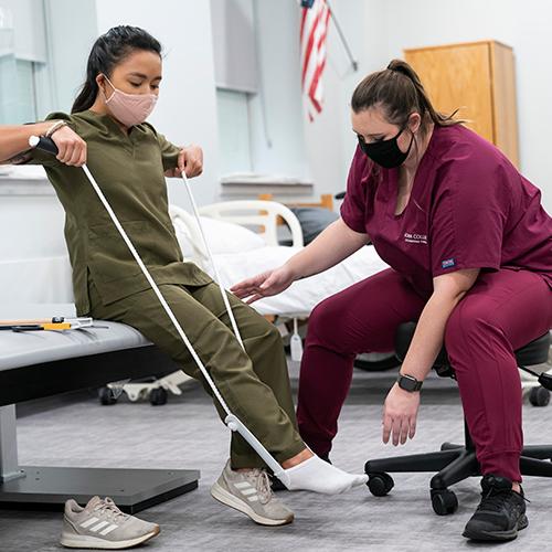 Occupational Therapy students practice stretching.