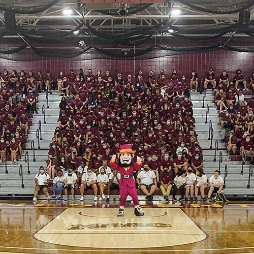 The Class of 2025 in the basketball arena with Killian.