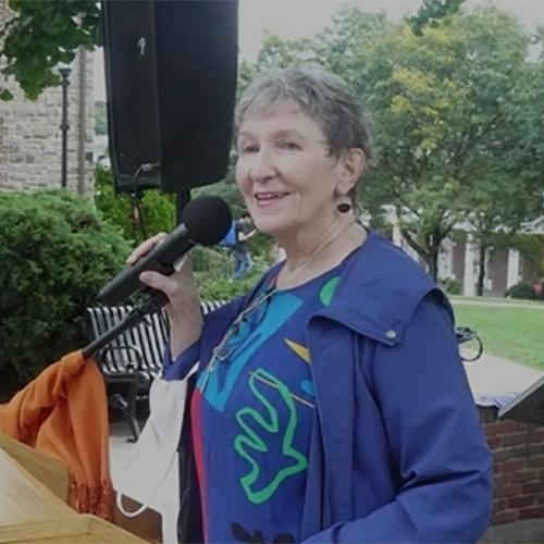 Sister Kathleen speaking at the microphone.