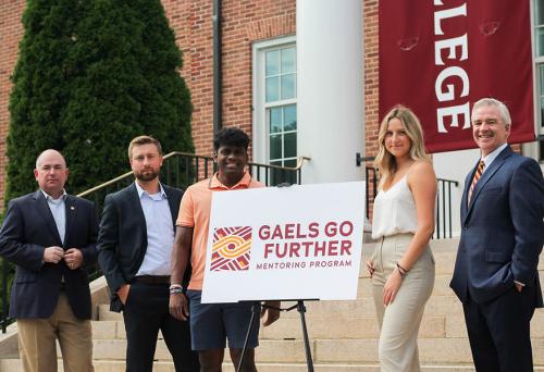 Three students pose with Jim Oates and President Carey for Gaels Go Further.