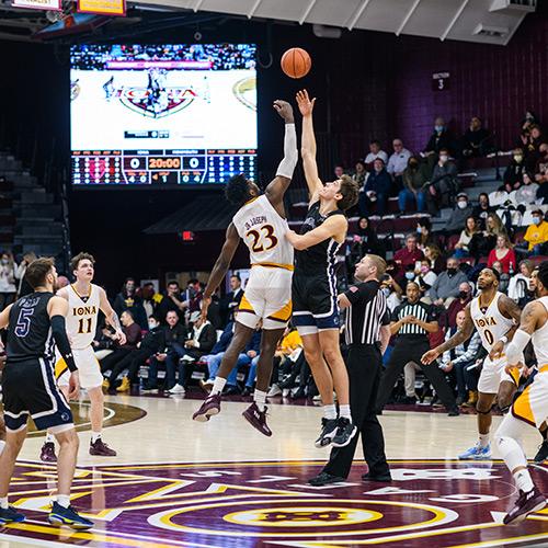 Nelly Junior Joseph wins the jump ball against Monmouth.