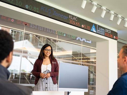 Students work on the trading floor in the LaPenta School of Business.