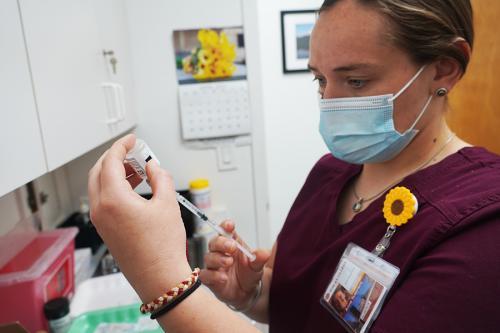 Nursing students distribute the vaccine at a clinic.