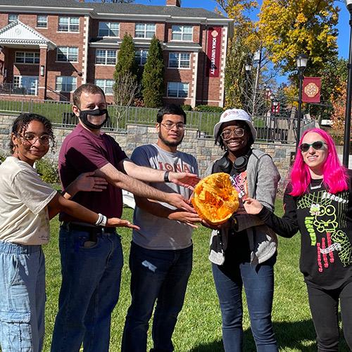 Five students from the Neurodiversity club at their smashing pumplins event.