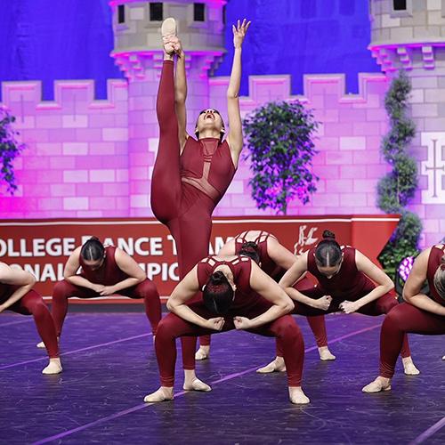 The Iona dance team doing a high kick.