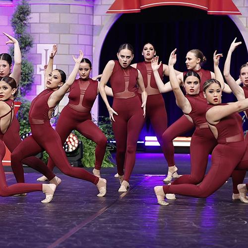 The Iona dance team in maroon costumes.