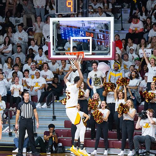 Os Shema dunking at a home game. 