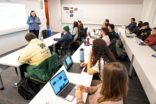 A professor teaches a class in the LaPenta School of Business.