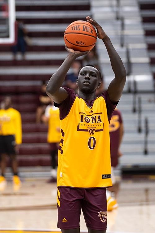 An Iona basketball player practices a free throw.