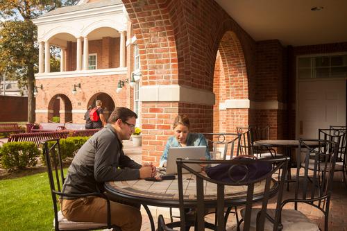 Students study outside of Ryan Library.