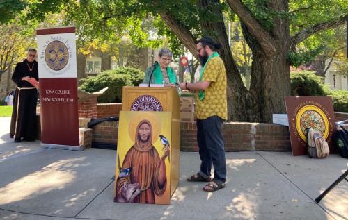 Sister Kathleen and Dr. Robinson at Lectern.