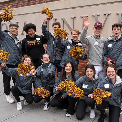 Gaels greet people at the entrance on North Ave. for orientation.