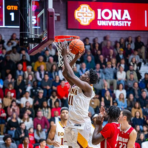 An Iona basketball player going in a for a dunk.