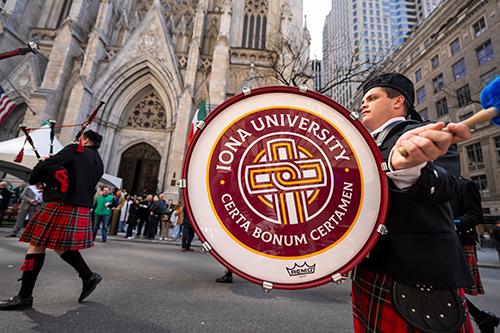 The pipe band marches past the Cathedral on St. Patrick's Day.