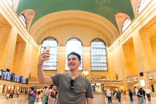 An Iona student takes a selfie in Grand Central Terminal.