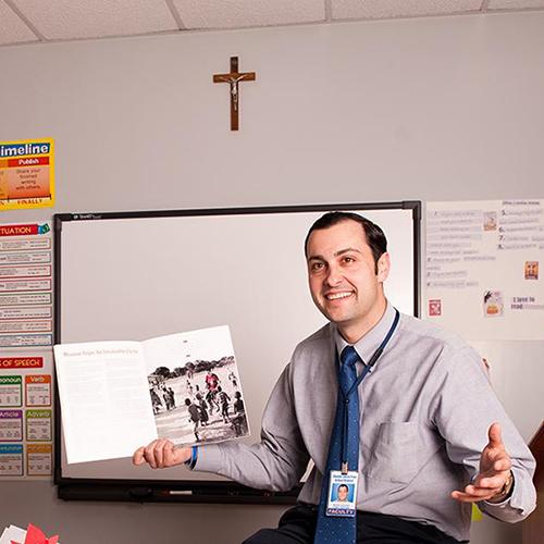 A Catholic school teacher at the head of the class.