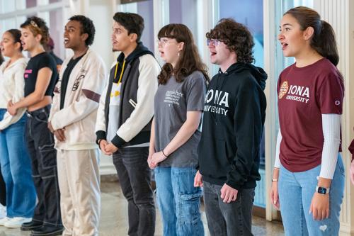 Memebers of the NightnGaels singing.