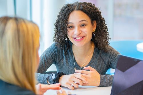 A student receives support and guidance from an advisor.