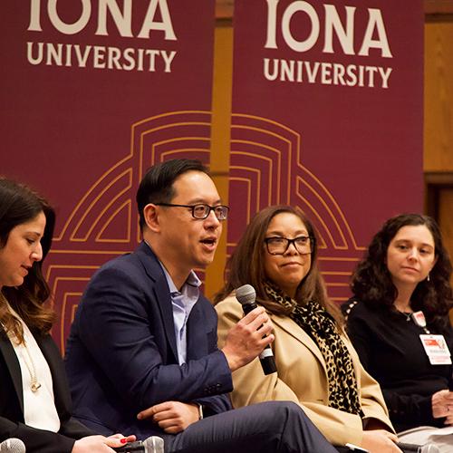 The Symposium on Health and Wellbeing speakers on stage.