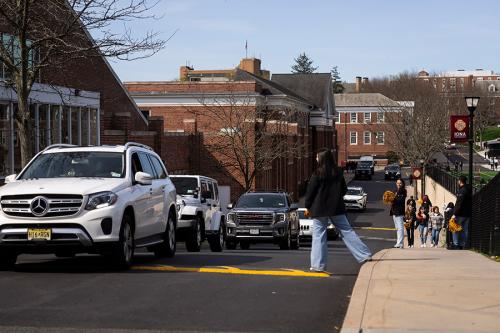 Cars drive into campus.