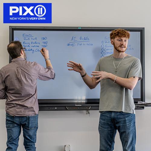 A student presents in a class about AI.