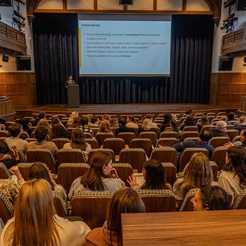 Dr. Aakash Sapru presents on innovation to an auditorium filled with Bronxville School faculty.
