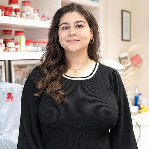 Jessica Said standing and smiling in the laboratory.