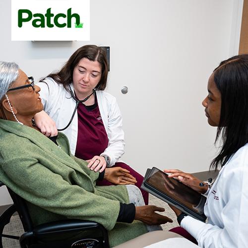 Patch News logo with two Iona nursing students, practicing on taking a fake patients' vitals.
