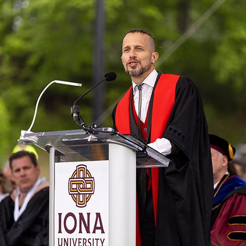 Dr. Burnett speaking at the 2026 Commencement Ceremony.