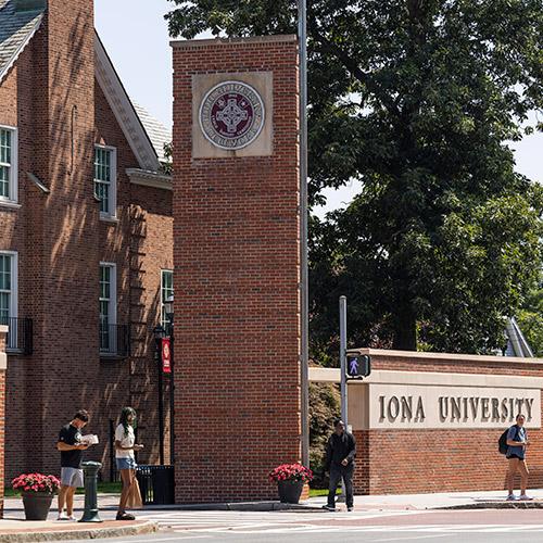The brick main entrance gateway to the Iona University campus.