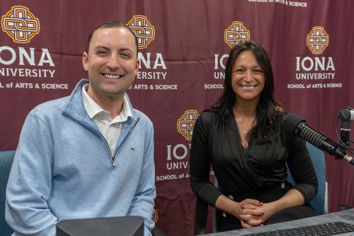 Victoria Bruno smiles alongside host Matt Ricker while seated at microphones during a recording session for the Iona University "On the Rise" podcast.