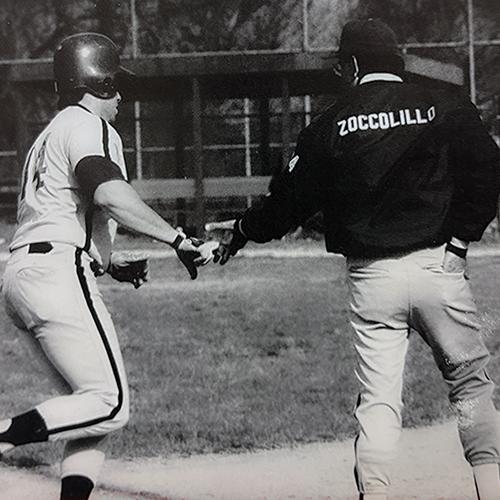 Old black and white photo of Coach Zoccolillo coaching third base.