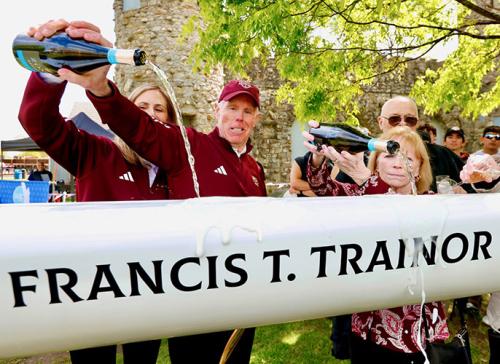 The Trainors christen the Francis T. Trainor Shell with champagne.