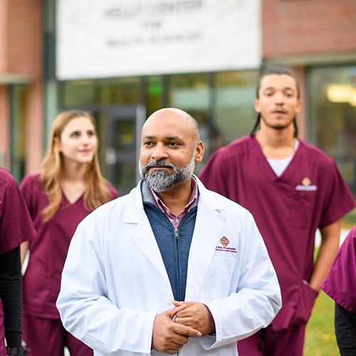 A healthcare administrator with his team.