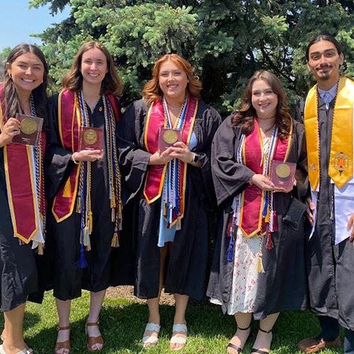 Kerri Shea and friends in regalia at Commencement.