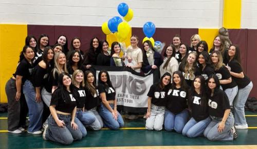 The 26-27 members of Psi Kappa Theta.