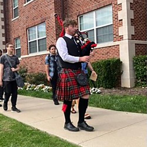 Man Playing Bagpipe