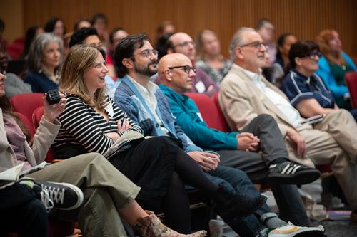 Attendees smile at The Future of Teaching Conference.
