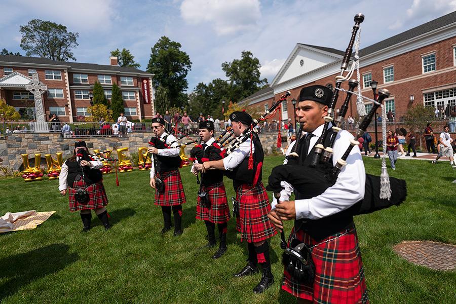 The Pipers play at the University birthday party.